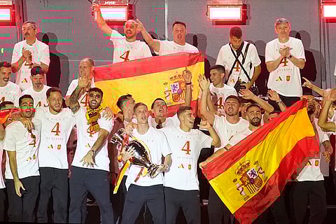 Dani Olmo holds the trophy during celebrations at Cibeles square in Madrid